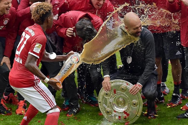 It's time for beer and cheer as coach Pep Guardiola is doused by Austrian midfielder David Alaba during Bayern's celebration of their fourth successive German Bundesliga crown. It was the Spaniard's 20th trophy as a coach and he wants to end on a hig