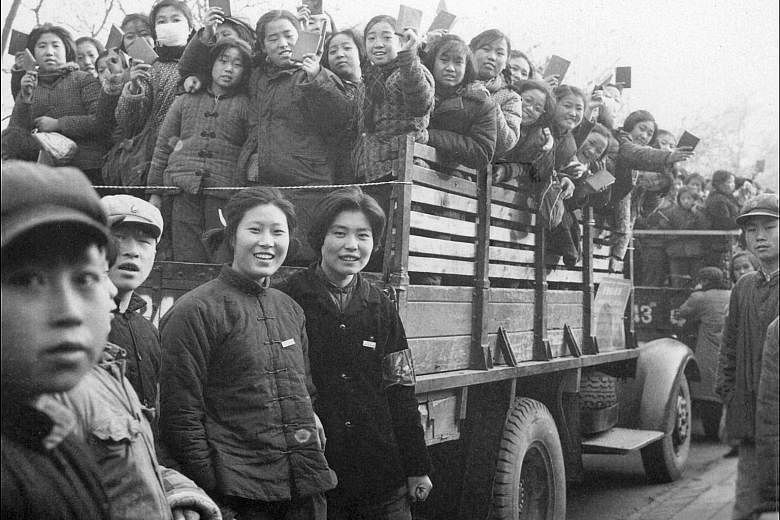 High school and university students, members of a Red Guard propaganda squad, brandishing copies of Mao Zedong's Little Red Book on the streets of Beijing during the Cultural Revolution, in this photo taken in 1966. Mr Cheng Baoluo planned to go to u