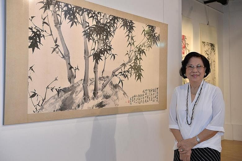 Painter Fan Chang Tien's daughter, Mrs Teresa Yao (left), is showing 60 of the artist's paintings.