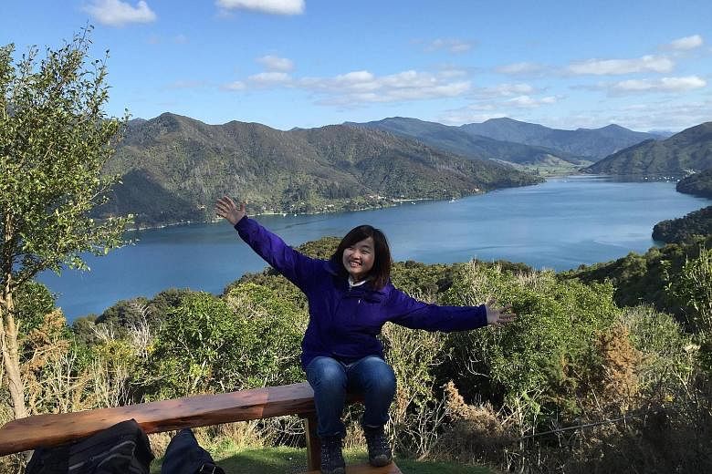 Ms Jo'di Koh packing peaches in Hawke's Bay on North Island. Through her jobs in New Zealand, she learnt more about differences in working attitudes across cultures. Ms Laurentia Yong at the Queen Charlotte Track in Picton. Taking on various odd jobs