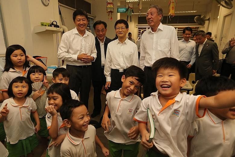 Kindergarten children at My First Skool in public housing project Treelodge@Punggol were all smiles yesterday when top Chinese official Meng Jianzhu (third from left) dropped in for a visit. The member of the Political Bureau of the Communist Party o