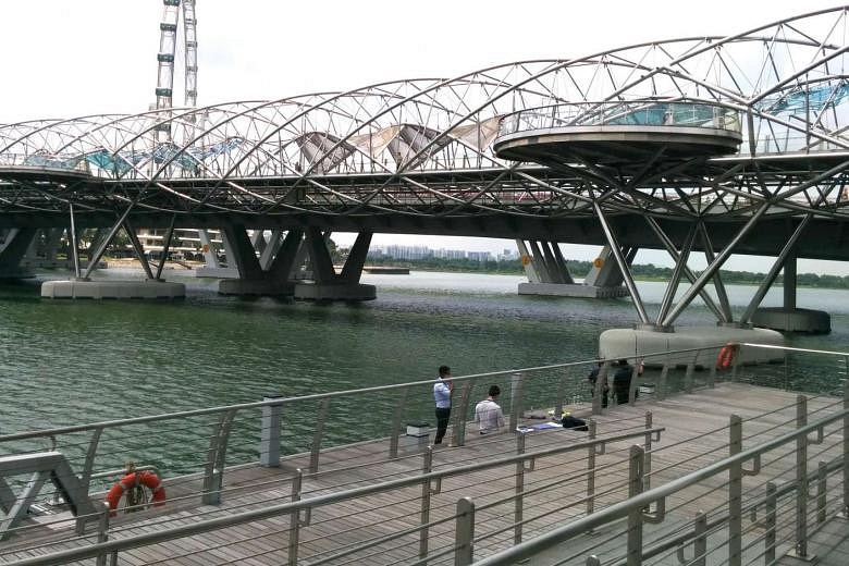 Woman dies a day after she was found floating in Singapore River near ...