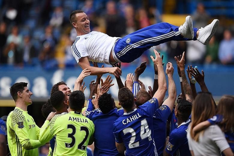 Chelsea defender John Terry, 35, is thrown by team-mates after the side's season-ender against Leicester City on Sunday. His future remains up in the air as he mulls over a one-year offer.
