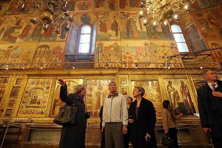 PM Lee and Mrs Lee inside the Dormition Cathedral of the Moscow Kremlin yesterday. At Red Square and the Kremlin, he bumped into Singaporeans on holiday.