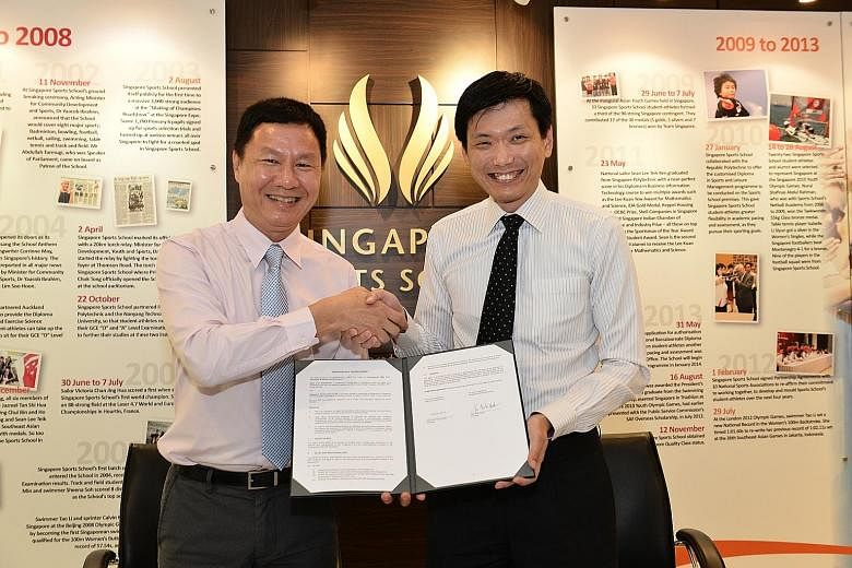 Singapore Sports School principal Tan Teck Hock (left) and Ngee Ann Polytechnic counterpart Clarence Ti at yesterday's memorandum of understanding signing.