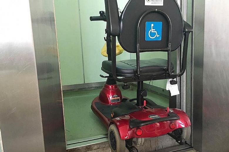 Mr Lim Hang Chiang's mobility device (far left) tipped as the floor of the lift was about 15cm higher than that of the lobby when the doors opened. (Left) A notice put up on the suspension of lift operation.