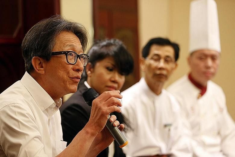 Manpower Minister Lim Swee Say at restaurant Lawry's The Prime Rib yesterday. He praised it for being an "early adopter" of job redesign for older workers, ahead of legislation to raise the re-employment age from 65 to 67 in July next year.