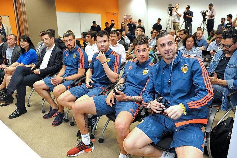 Valencia coach Pako Ayestaran and several first-team players are in town for a few days to do community work. They will also unveil plans for next year's full visit. At yesterday's press conference were (from right) goalkeeper Jaume Domenech, striker