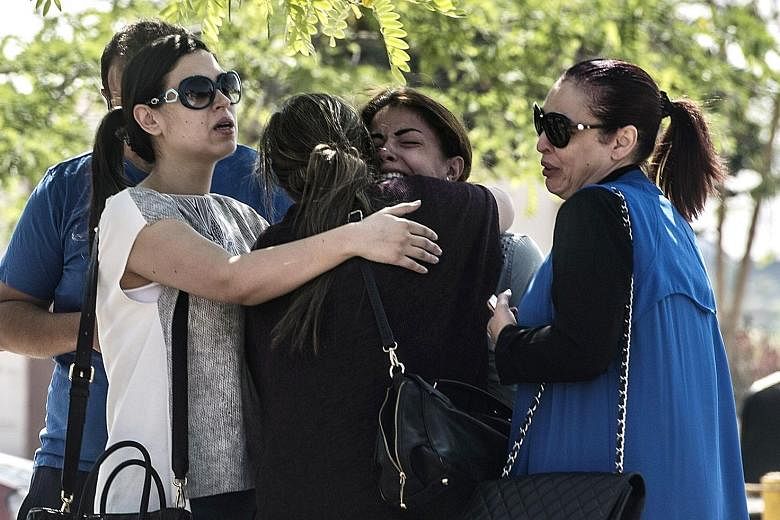 Anxious relatives of passengers aboard the EgyptAir plane waiting for news at the Cairo airport yesterday. Flight MS804, which had 66 people on board and was heading to Cairo from Paris, did not make any distress call before it went down.
