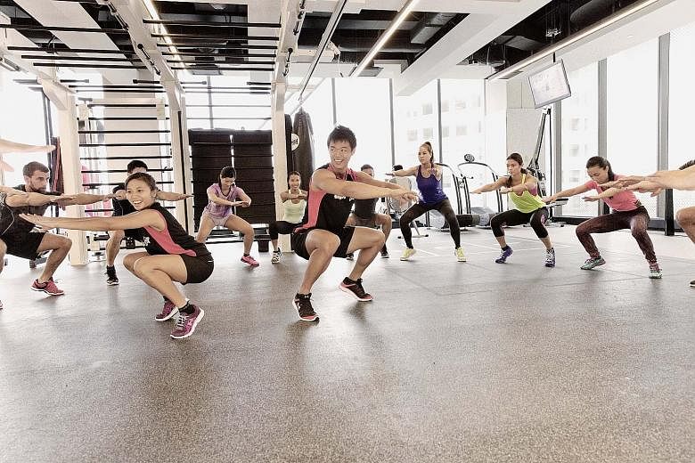 Virgin Active club members participating in a high-intensity interval training workout.