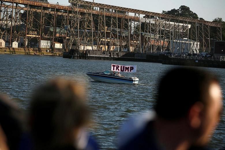 A boat with a sign showing support for presumptive Republican presidential nominee Donald Trump near Waterfront Park in Vallejo, California. The Federal Election Commission made public on Wednesday a 104-page financial disclosure form from Mr Trump.