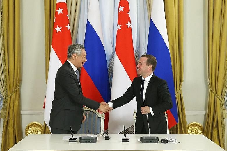 PM Lee and PM Medvedev at a media conference at the Government Reception House in Moscow yesterday. PM Lee will attend the Asean-Russia Commemorative Summit in Sochi today.