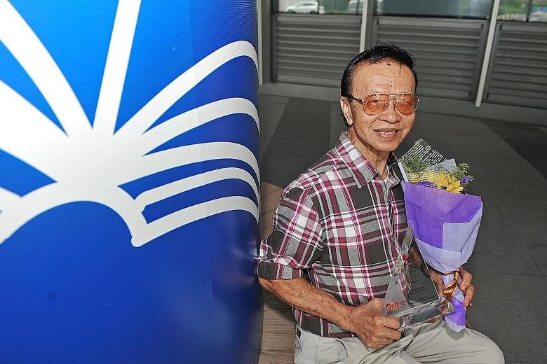 Mr Goh, who has not taken sick leave for the past 15 years, shows off his May Day Partnership Award. The 85-year-old was one of 63 individuals and firms honoured yesterday by the labour movement.