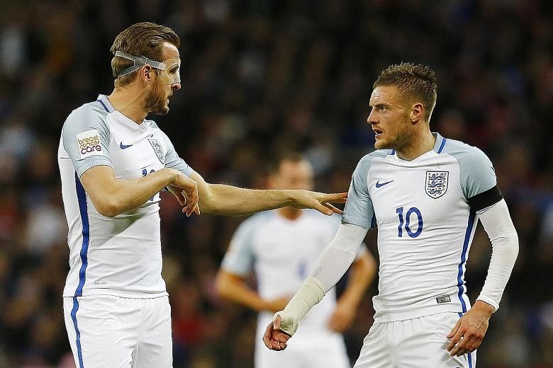 Harry Kane (far left) passing on instructions to Jamie Vardy after coming on as a substitute for England against the Netherlands at Wembley in March. Vardy scored in the 1-2 loss and both will fancy their starting chances at Euro 2016 next month if m