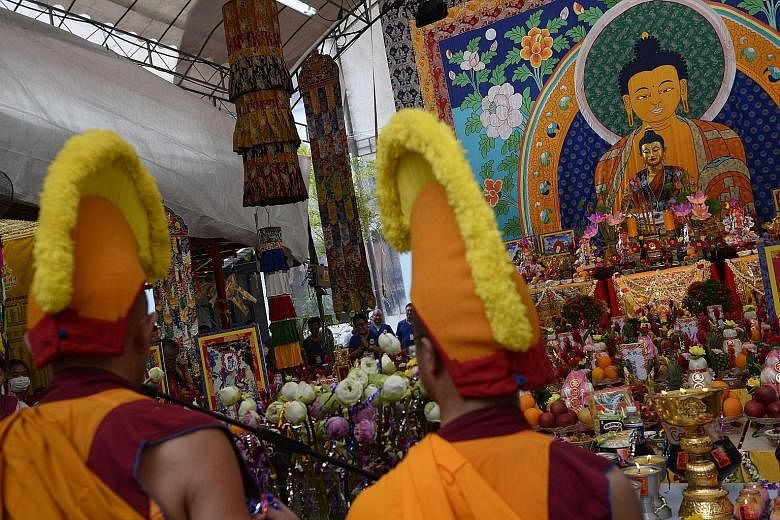 An image of Buddha in silk, that is four storeys high, was the centrepiece of celebrations at the Thekchen Choling temple in Jalan Besar.