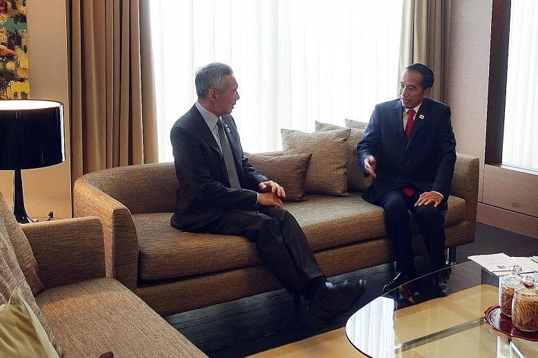 PM Lee with President Joko Widodo in Sochi ahead of the summit on Friday. The two leaders happened to stay at the same hotel and on the same floor.