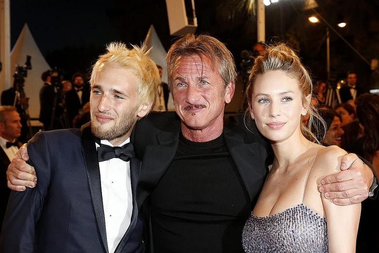 Director Sean Penn with his children Hopper (left) and Dylan Frances at the screening of his work, The Last Face, in Cannes last Friday.