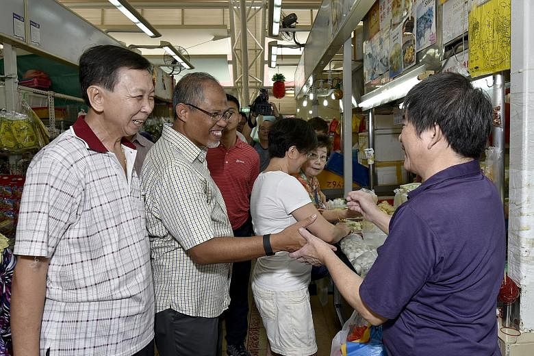 Mr Masagos met stallholders and residents during his community visit yesterday to the Eunos ward in Aljunied GRC.