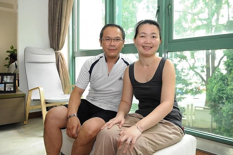 Ms Lim with her husband, Mr Goh. The left half of Ms Lim's body remains weak and she has to use a wheelchair to get around. Her parents-in-law are taking care of her youngest child as she is unable to do so herself. But Ms Lim says being positive goe