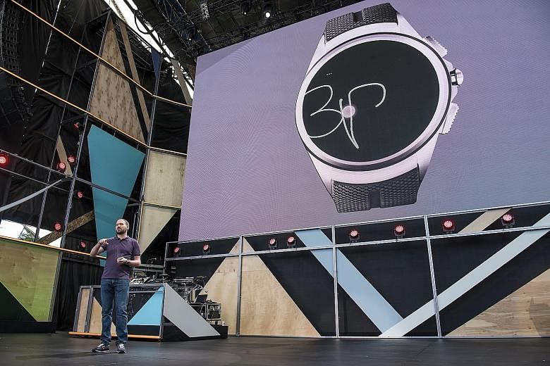 Mr David Singleton, Google's director of Android engineering, showing the audience at the Google I/O event last week how, with Android Wear 2.0, users can write on their watches using their fingers.