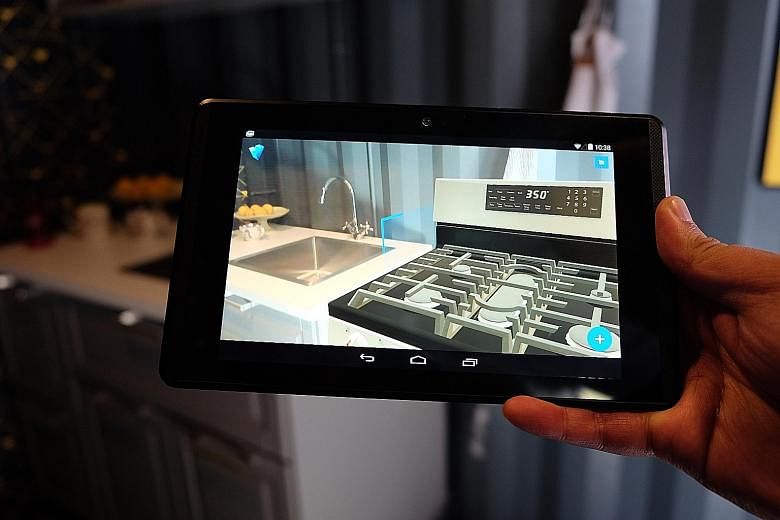 Google shows off its augmented reality software, named Project Tango, at Google I/O 2016. It allows users to overlay virtual furniture in real time over a live view of their home.