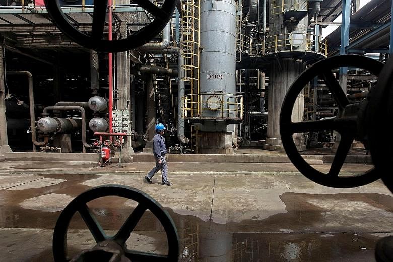A refinery in Hubei, China. JPMorgan Chase, Bank of America and Citigroup said they were setting aside more money to cover losses from energy loans after oil's collapse.