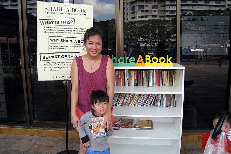 Nee Soon resident Meyar Lwin, 34, says she has taken a few comic books for her son from the neighbourhood's book exchange corner, which is located outside the town council office at Block 290, Yishun Street 22.
