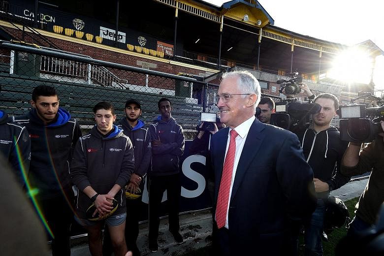 Prime Minister Malcolm Turnbull meeting trainees in a leadership programme in Melbourne yesterday. Some younger Australians say they are put off by the major parties or think their votes will not count.