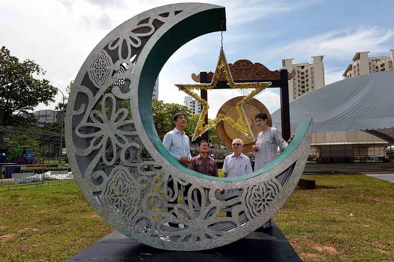 Members of the Hari Raya light-up committee include (from left) Mr Tan, Mr Eric Wong, chairman of Geylang Serai Citizens' Consultative Committee, Dr Teo Cheng Swee, chairman of Kembangan-Chai Chee CCC, and Dr Fatimah.