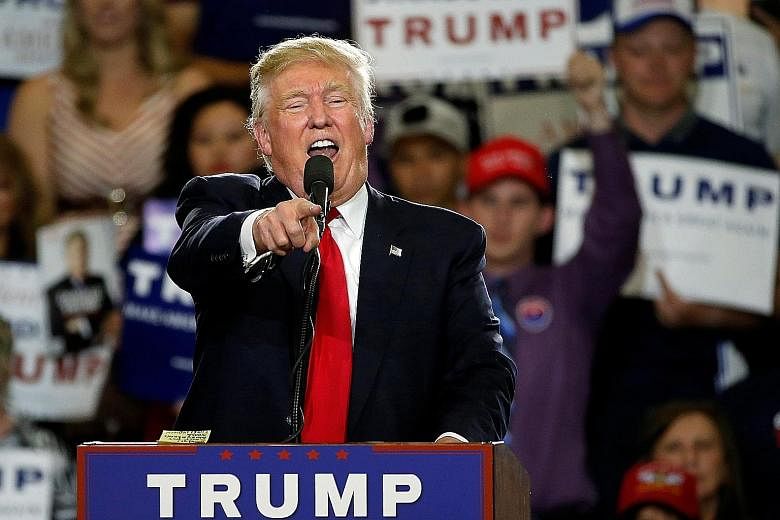 Protesters disrupting a rally by Republican presidential candidate Donald Trump and his supporters in Albuquerque, New Mexico, on Tuesday. The protesters threw stones at police horses and lit fires, according to the police and postings on social medi