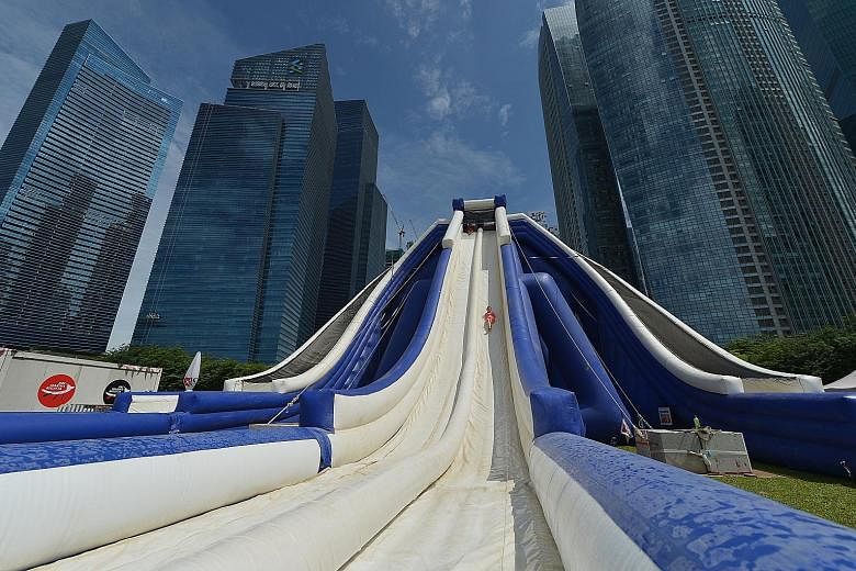 Up to four people can ride the 16m-high inflatable slide at a time at the DBS Marina Regatta.