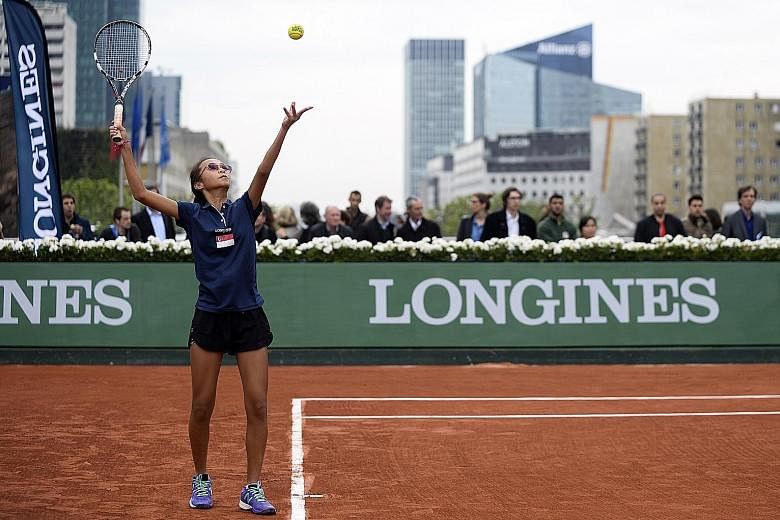 Alexis Tan serving against her opponent Nikki Yanez at the Longines Future Tennis Aces tournament in Paris. With her first forays into competitive tennis, the Singaporean has been rubbing shoulders with the who's who of tennis.