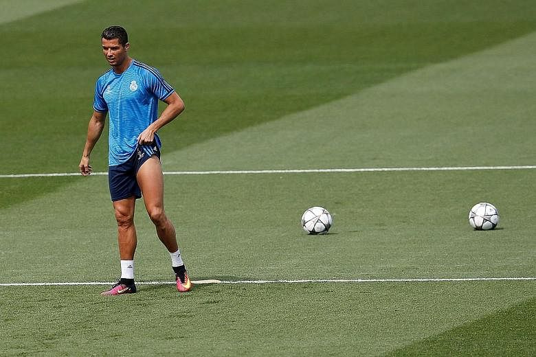 Real Madrid forward Cristiano Ronaldo at a training session on Tuesday. He ended that session prematurely but insists he will be fully fit for tomorrow's Champions League final.