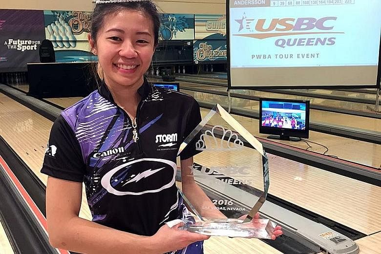 Singapore bowler Bernice Lim (left) showing her biggest individual trophy after beating top seed Sandra Andersson to claim the USBC Queens title, a major event on the PWBA tour. Team-mate Cherie Tan (right) was also victorious on Thursday, winning th