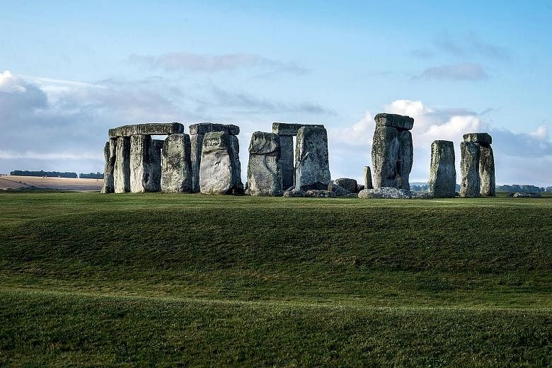 Stonehenge (above) in England and Australia's Great Barrier Reef (below) are among the world's heritage sites that are already feeling the impact of climate change, say scientists. All references to Australia were cut from the report after objections