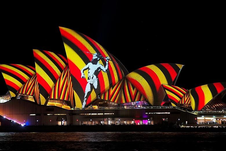An image of an indigenous Australian man projected onto the sails of the Sydney Opera House during the opening of the annual Vivid Sydney light festival last night. The Opera House will transform over the festival's 23 nights into an animated canvas 