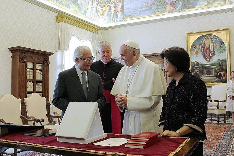 President Tan and the Pope exchanged gifts during their meeting yesterday in the Pope's library. Dr Tan was accompanied by his wife Mary. Dr Tan gave the Pope an artwork of Gardens by the Bay and a book on flowers, and received from him a medallion d