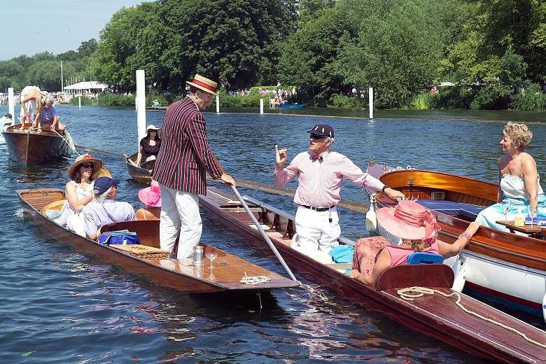 Spectators at the Henley Royal Regatta at Henley-on- Thames near Oxford, England.