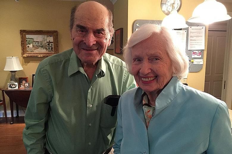 Dr Henry Heimlich with Madam Patty Ris, 87, the woman he saved with his manoeuvre after she choked on food. She was having her meal at the same table as Dr Heimlich at a senior centre in Cincinnati.
