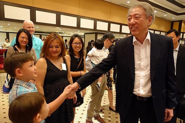 DPM Teo greeting Singaporeans living in Thailand at the Banyan Tree hotel in Bangkok yesterday. Mr Teo, who is also the Coordinating Minister for National Security, hopes to discuss security concerns with Thai officials during his two-day trip to the