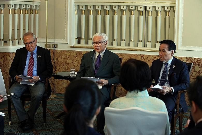 President Tan speaking to the media at the end of his eight-day state visit to Italy and the Holy See yesterday. With him were Mr Barry Desker (far left), Non-Resident Ambassador of Singapore to the Holy See, and Mr Ow Chio Kiat (at right), Non-Resid