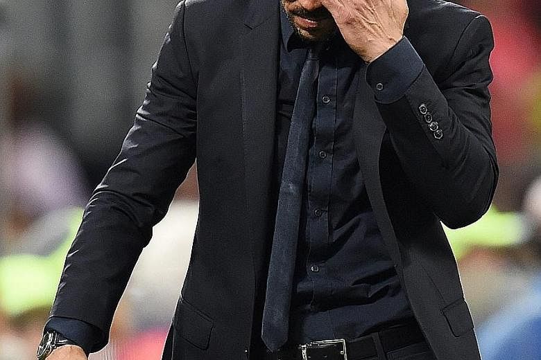 Real manager Zinedine Zidane and Atletico boss Diego Simeone (above) show contrasting emotions after the final whistle at the San Siro in Milan.