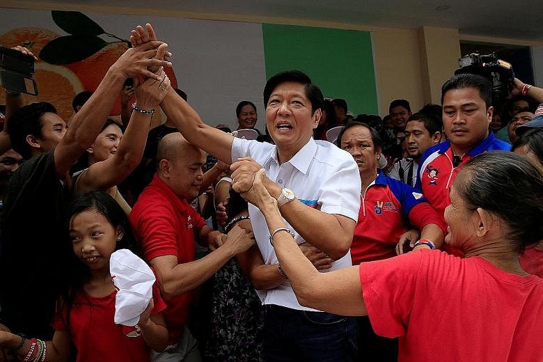 Mr Marcos with supporters at a campaign rally in Manila on May 7. He has been adept at channelling the good memories of his father and namesake, the dictator Ferdinand Marcos, while keeping his distance from the bad ones.