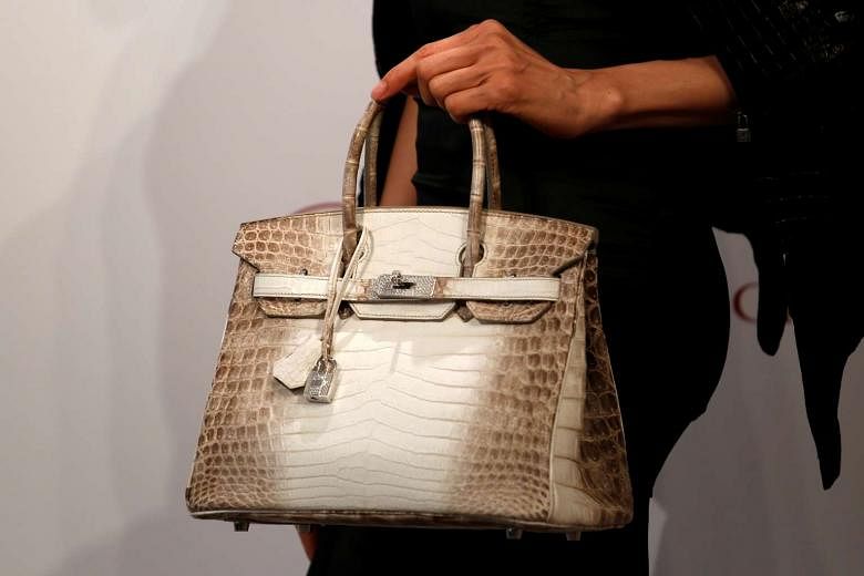 Diamond-encrusted crocodile-skin Hermes handbag sold for record $412,000 at  auction