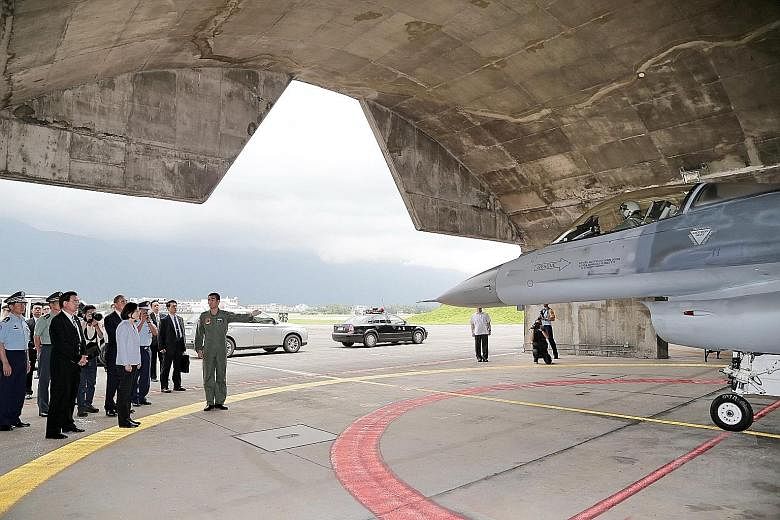 Ms Tsai inspecting the Hualien airbase, one of two airbases she visited in eastern Taiwan, on Sunday. As President, she is also the commander-in-chief of the Taiwanese military. The base is one of Taiwan's most important combat airbases, while the ne