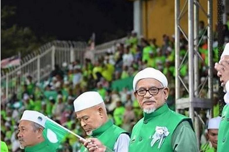 PAS leaders (from left) deputy president Tuan Ibrahim Tuan Man, spiritual leader Haron Din and president Abdul Hadi Awang. Malaysia's Islamic party begins a much-watched annual assembly today, with its leaders trying to restore the faith of members a