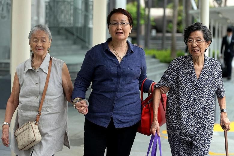 Heading to court yesterday to observe former China tour guide Yang Yin's trial were (from left) Madam Chung Khin Chun, her niece Hedy Mok and family friend Chang Phie Chin. Yang faces 347 charges related to immigration offences and falsification of r