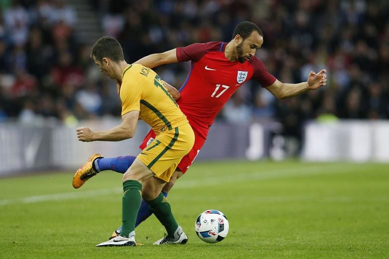 Andros Townsend (No. 17) in action against Australia's Matt McKay on Friday. The England player was omitted yesterday from Roy Hodgson's Euro 2016 squad, along with Danny Drinkwater and the injured Fabian Delph. 