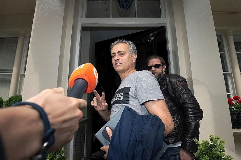 Manchester United's new manager Jose Mourinho (centre) outside his home in central London last week. Amid media speculation on his plans in the transfer market, the Portuguese has revealed that he will not be signing a midfielder from his country.