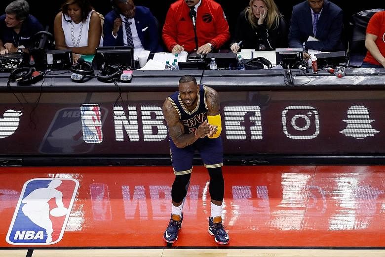 LeBron James urging his fellow Cavaliers on during the Eastern Conference Finals against the Toronto Raptors. He has vowed to make Cleveland NBA champions.